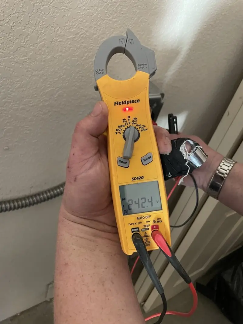 Voltage testing with clamp meter during Electrical Installation Services in Strasburg